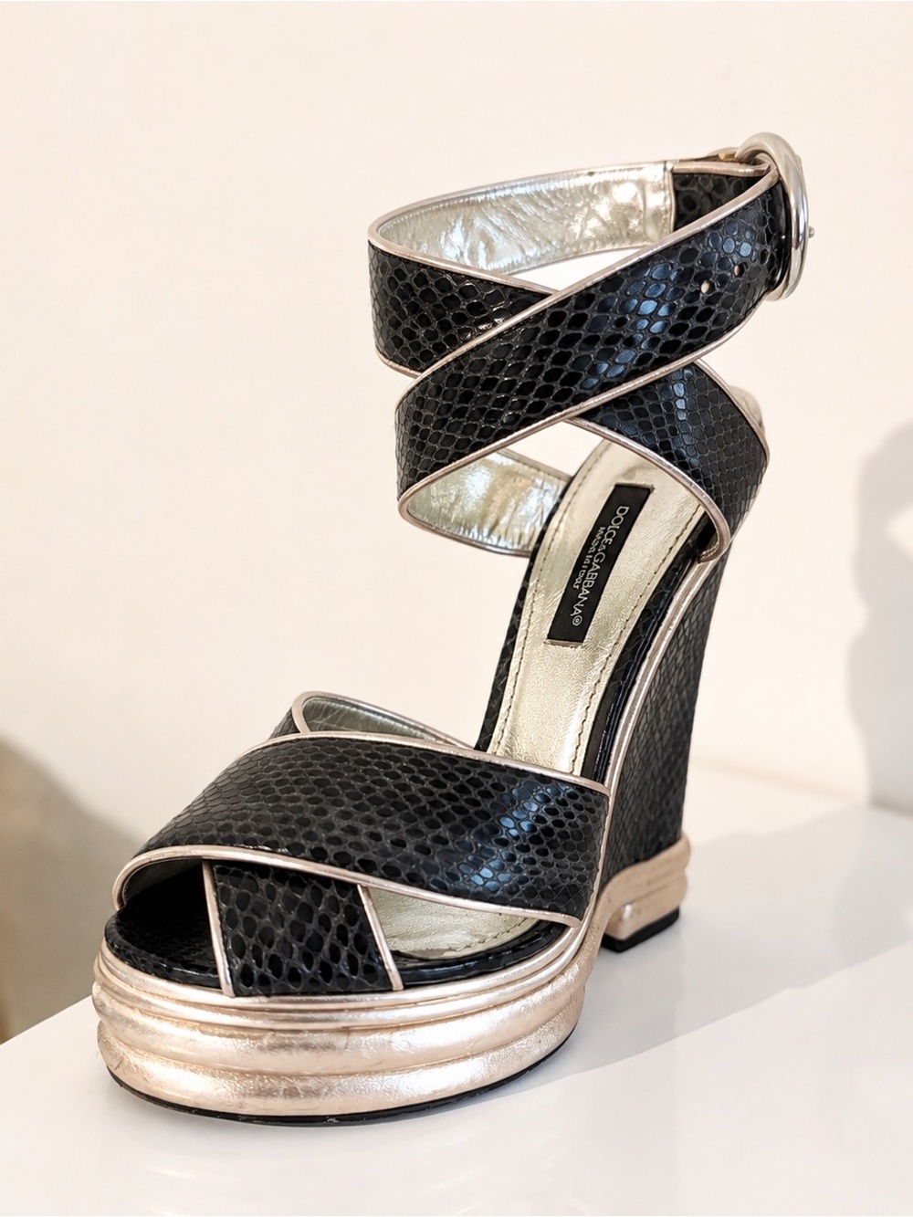 Dolce & Gabbana Black Snakeskin Wedge Sandals with Gold Accents..